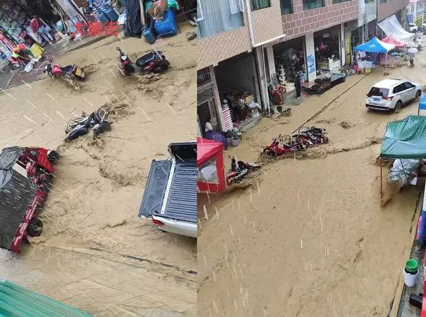 云南红河山洪冲走摩托车，商家冒雨打捞货物，商家：没什么损失，但要打扫几个小时